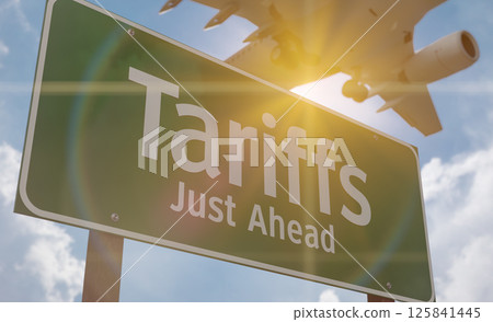 Tariffs Just Ahead Green Road Sign Against Clouds and Sky with Airplane Flying Above. Tariffs Just Ahead Green Road Sign Against Clouds and Sky with Airplane Flying Above. 125841445