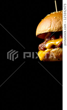 Great burger on a dark isolated phone 125842473