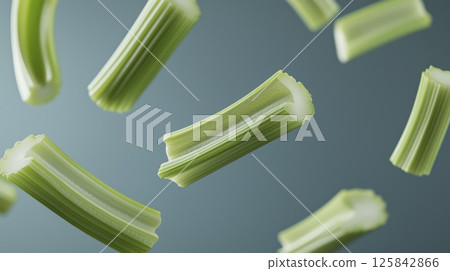 Flying celery sticks, soft shadow and blur, copy space 125842866