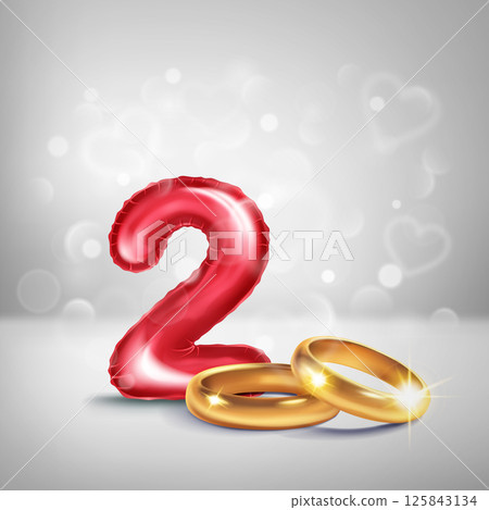 Red number 2 and gold wedding rings. 125843134