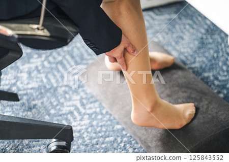 Woman suffering from tired legs 125843552