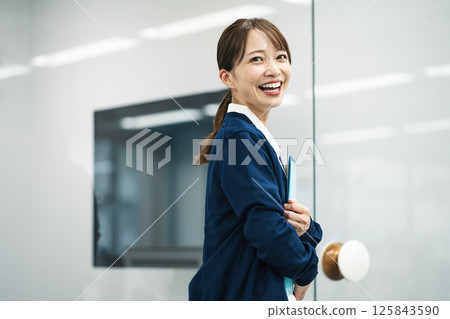 A middle-aged woman working in the medical field A middle-aged woman working in the medical field 125843590