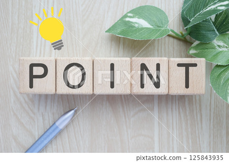 The word POINT written on a wooden block 125843935