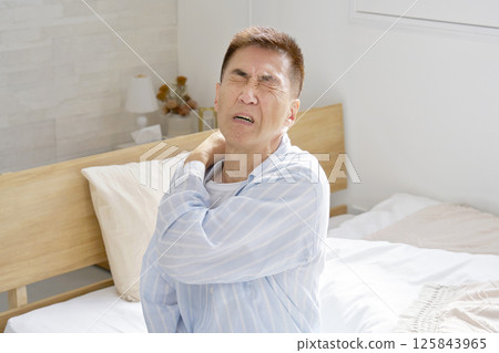 Middle-aged man in pajamas, fatigue Middle-aged man in pajamas, fatigue 125843965
