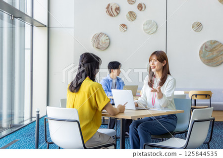 Woman working in coworking space 125844535