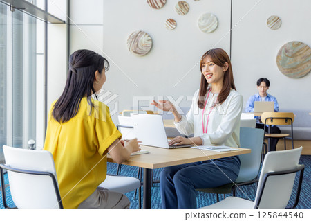 Woman working in coworking space 125844540