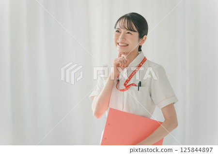 A young nurse thinking about something 125844897