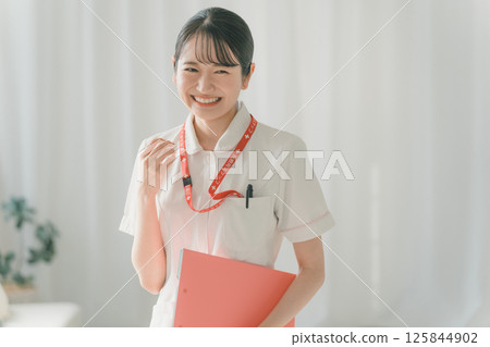 Young nurse laughing out loud 125844902