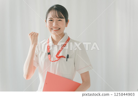 Young nurse's fist pump Young nurse's fist pump 125844903