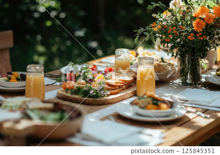 Cozy Sunday Brunch Setup in a Garden with Flowers 125845351