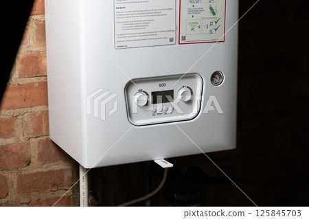 Corby, U.K., 1 January, 2025: Control panel of central heating at combi boiler. Increasing price for gas 125845703