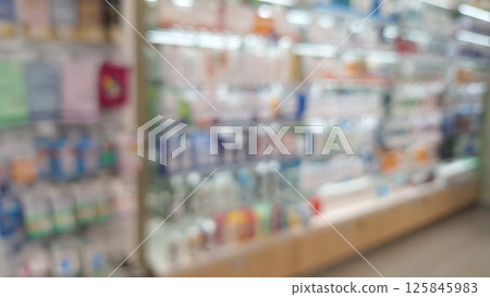 Blurred view of colorful pharmacy shelf display . Blurred view of colorful pharmacy shelf display . 125845983