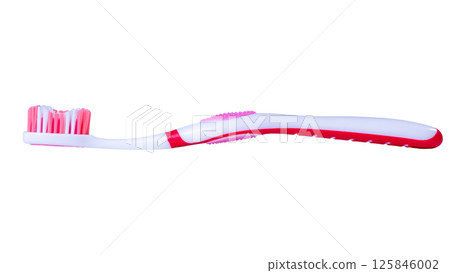 Red and white manual toothbrush with soft bristles on isolated background Red and white manual toothbrush with soft bristles on isolated background 125846002