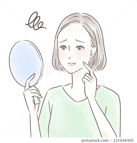 一位女士一邊看著手鏡,一邊擔心自己的臉頰 一位女士一邊看著手鏡,一邊擔心自己的臉頰 125846485