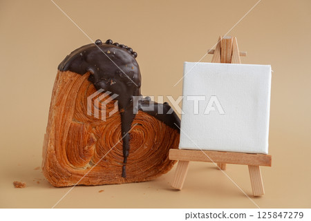 Empty paper note template greeting card mock up Delicious fresh croissant topped with Dark chocolate flavor Ganache. Creation unique heart shape bakery. Puff pastry holiday love gift present idea Empty paper note template greeting card mock up Delicious fresh croissant topped with Dark chocolate flavor Ganache. Creation unique heart shape bakery. Puff pastry holiday love gift present idea 125847279