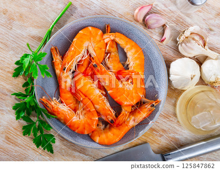 Seafood appetizer. Roasted langostins served with parsley Seafood appetizer. Roasted langostins served with parsley 125847862