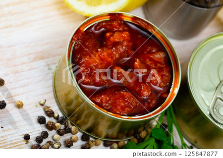 Canned squid in tomato sauce 125847877