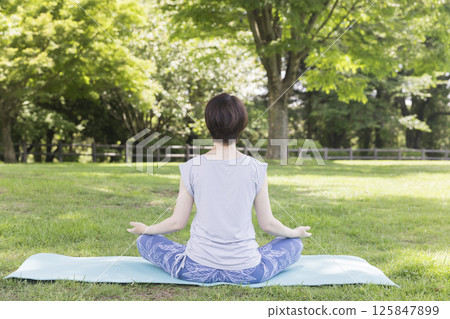 Woman doing reverse warrior outdoors Outdoor yoga image 125847899