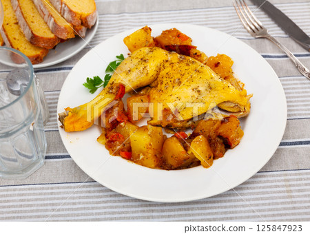 Beautifully served dish of grilled chicken thigh with fried potatoes Beautifully served dish of grilled chicken thigh with fried potatoes 125847923