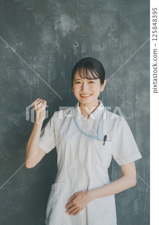 A young nurse doing a fist pump 125848395
