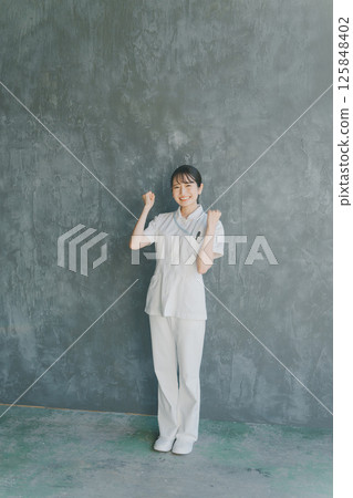 A young nurse doing a fist pump 125848402