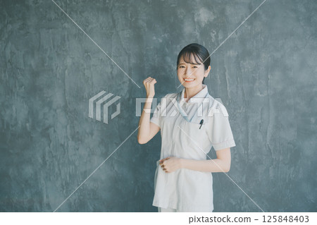 Young nurse's fist pump 125848403