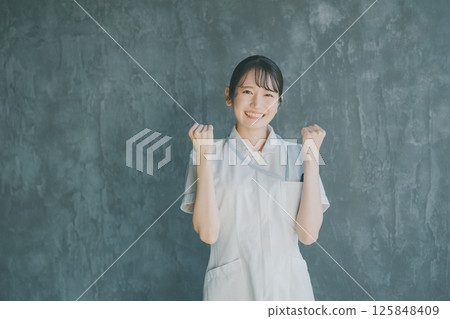 Young nurse's fist pump 125848409