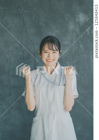 Young nurse's fist pump Young nurse's fist pump 125848413