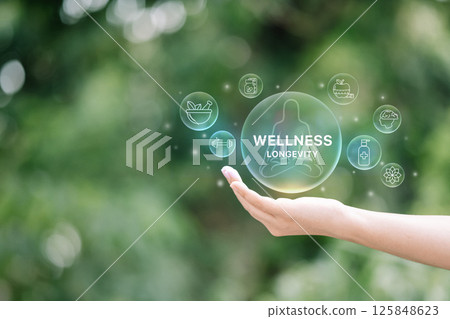 Health and wellness concept with glowing icons including fitness, and mental care, floating above a hand. 125848623