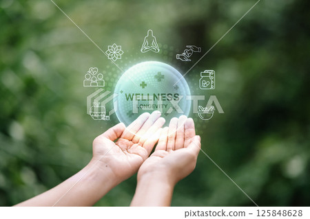 Wellness and longevity infographic over human hand with green blurred background. 125848628