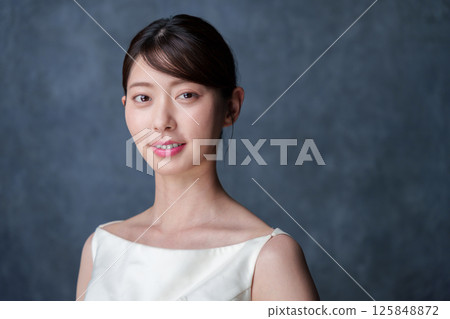 A young woman with a smile 125848872