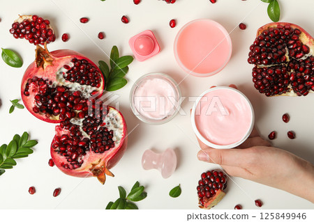 Self care and skincare products concept - pomegranate cosmetics Self care and skincare products concept - pomegranate cosmetics 125849946