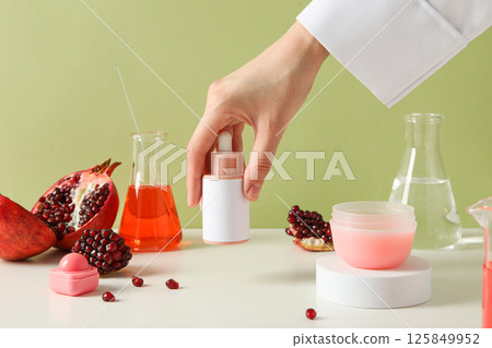 Self care and skincare products concept - pomegranate cosmetics Self care and skincare products concept - pomegranate cosmetics 125849952