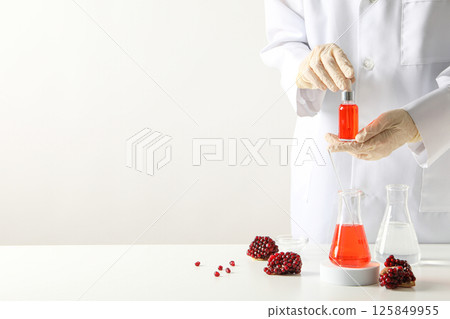 Self care and skincare products concept - pomegranate cosmetics Self care and skincare products concept - pomegranate cosmetics 125849955