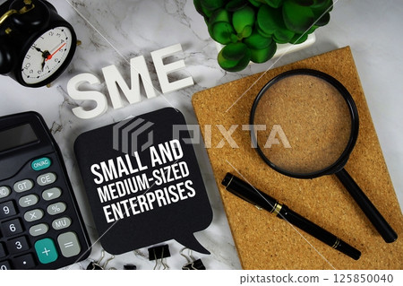SME - Small And Medium-sized Enterprises acronym with calculator, alarm clock and magnifying glass, business concept background 125850040