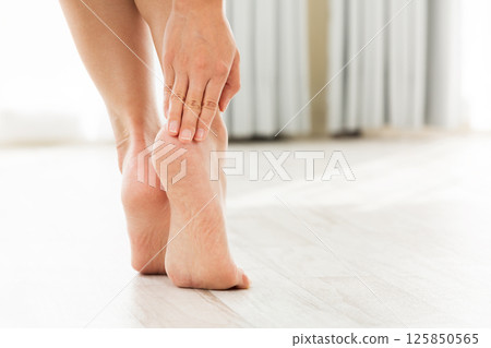 Women are doing skin care for their heels. Women are doing skin care for their heels. 125850565