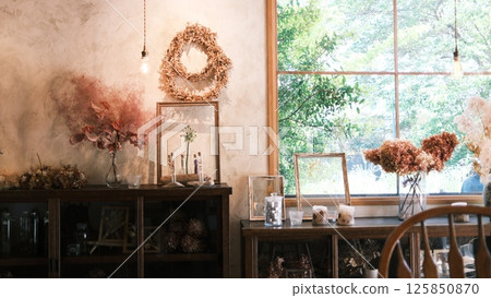 a Incandescent bright bulb under the rooftop of Preserved flower in a natural farm house 125850870