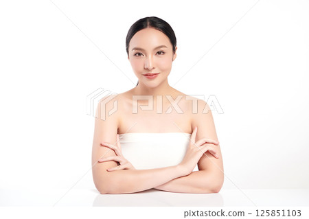 A beautiful young Asian woman with clean, fresh skin against a white background. Skincare, facial treatment, cosmetology, beauty, and spa. An elegant portrait of an Asian woman. A beautiful young Asian woman with clean, fresh skin against a white background. Skincare, facial treatment, cosmetology, beauty, and spa. An elegant portrait of an Asian woman. 125851103