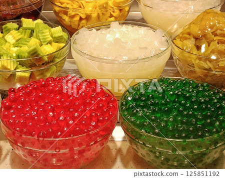 Variety of toppings for Asian desserts with colorful bubbles 125851192