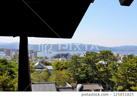 View of the National Treasure Matsue Castle Keep, Lake Shinji, and Yomegashima Island 125851825