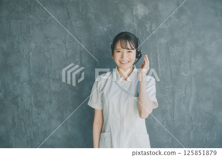 Nurse wearing a headset Nurse wearing a headset 125851879