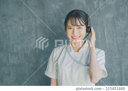 Nurse wearing a headset Nurse wearing a headset 125851880
