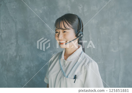 Nurse wearing a headset Nurse wearing a headset 125851881