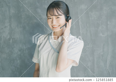 Nurse wearing a headset Nurse wearing a headset 125851885