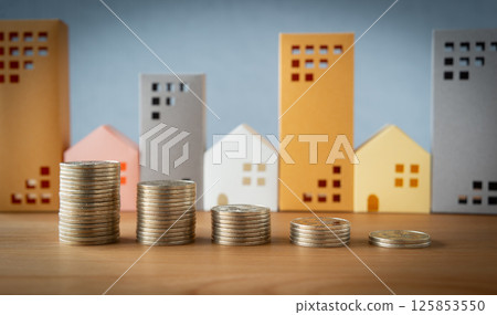 Coins and real estate lined up, asset depreciation, depreciable assets, legal useful life 125853550