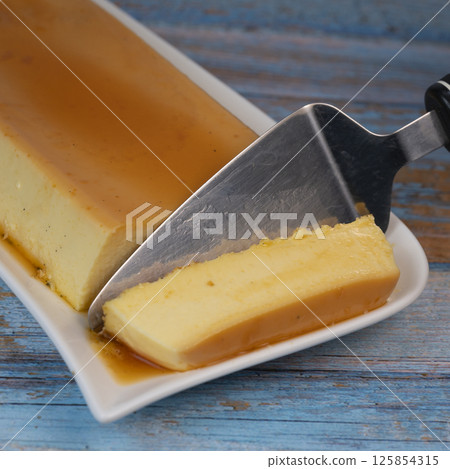 Cream caramel pudding with caramel sauce on a plate, Flan Cream caramel pudding with caramel sauce on a plate, Flan 125854315