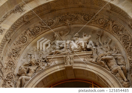 Intricate Stone Relief on Historic Archway. 125854485