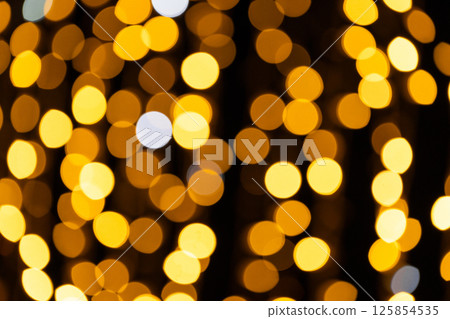 Golden bokeh lights for festive and event background design 125854535