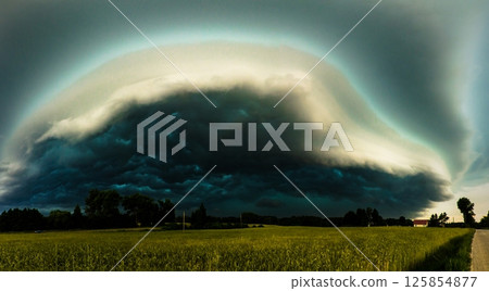 Mesocyclone supercell storm cloud over a field. Extreme wind, hail and lightning. 125854877