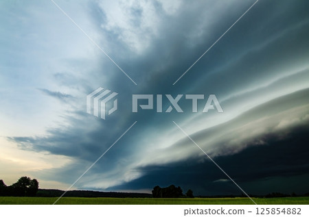 Supercell storm clouds with intense tropic rain. Lithuania Supercell storm clouds with intense tropic rain. Lithuania 125854882
